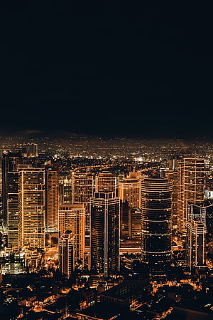 Aerial View of Illuminated Skyscrapers and City Lights at Night HD phone wallpaper