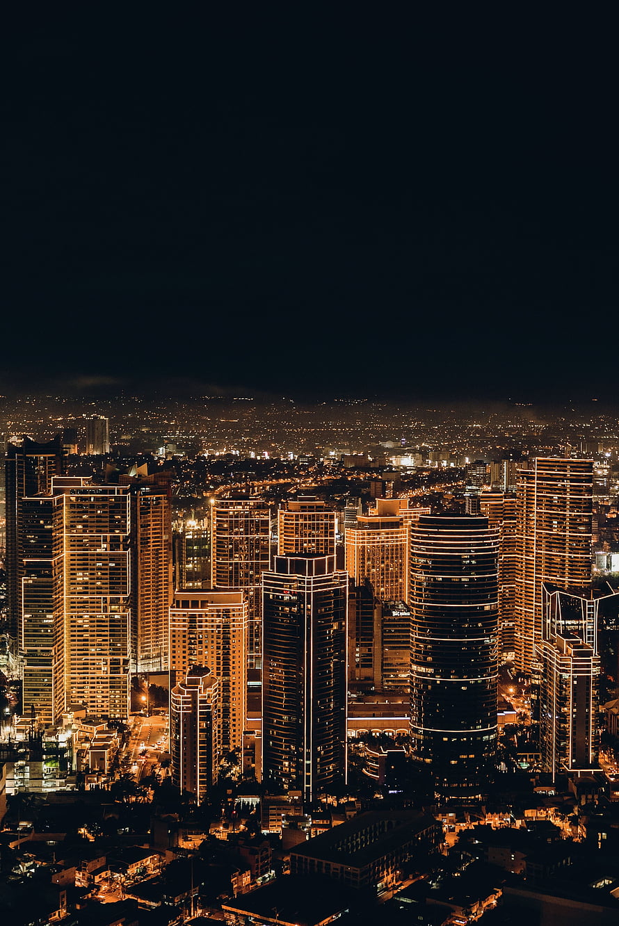 Aerial View of Illuminated Skyscrapers and City Lights at Night HD phone wallpaper