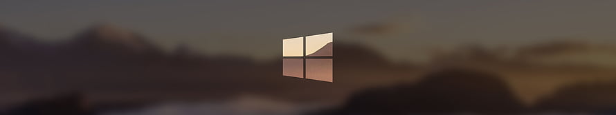 Windows 10 Logo Over Blurred Mountain Landscape at Dusk HD wallpaper