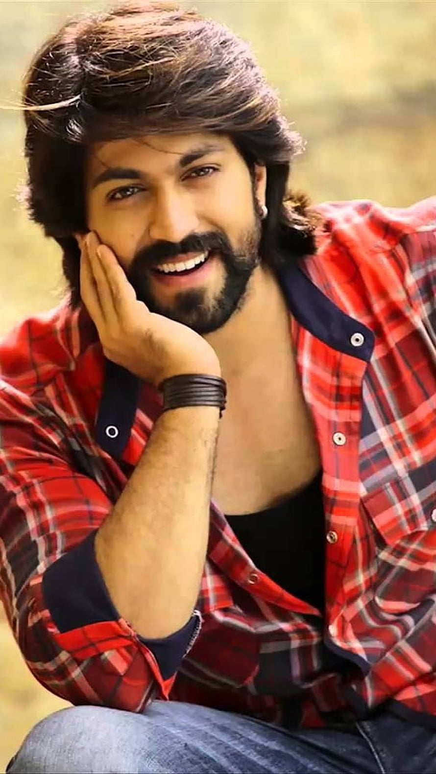 Yash in Red Plaid Shirt with Bearded Smile and Relaxed Outdoor Pose HD phone wallpaper