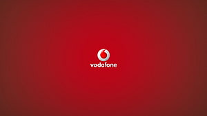 Vodafone Corporate Logo on Deep Red Gradient Background HD wallpaper