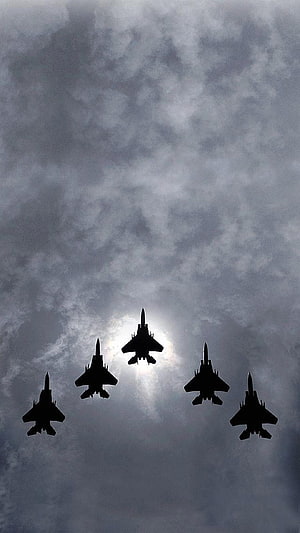 Five Military Fighter Jets Silhouetted in Formation Against Dramatic Cloudy Sky HD phone wallpaper