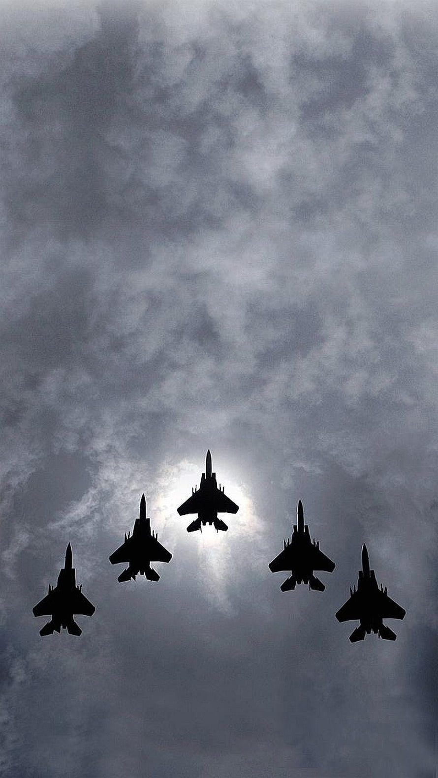 Five Military Fighter Jets Silhouetted in Formation Against Dramatic Cloudy Sky HD phone wallpaper