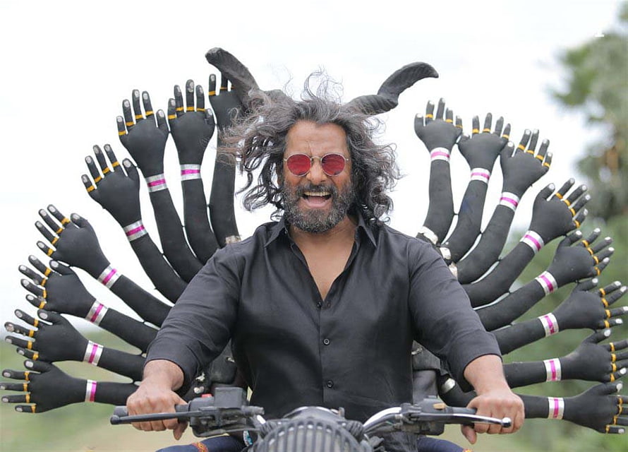 Vikram as the multi-armed demon character on a motorcycle in the film Mahaan HD wallpaper