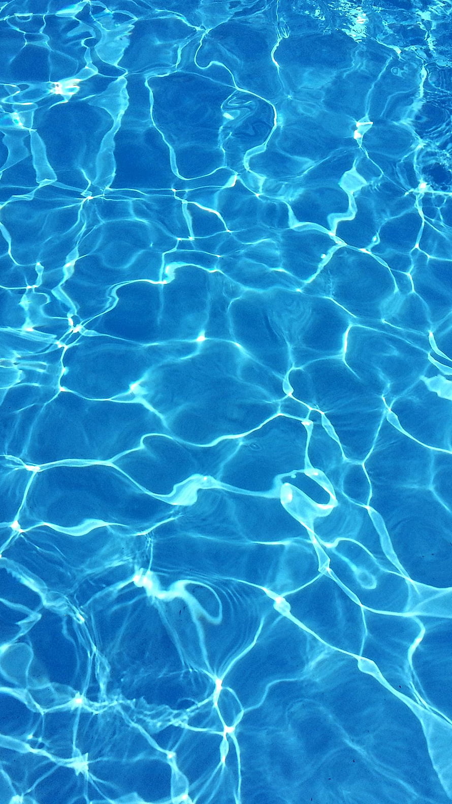 Cascading Blue Water Ripples with Bright Sunlight Reflections and Caustic Patterns HD phone wallpaper