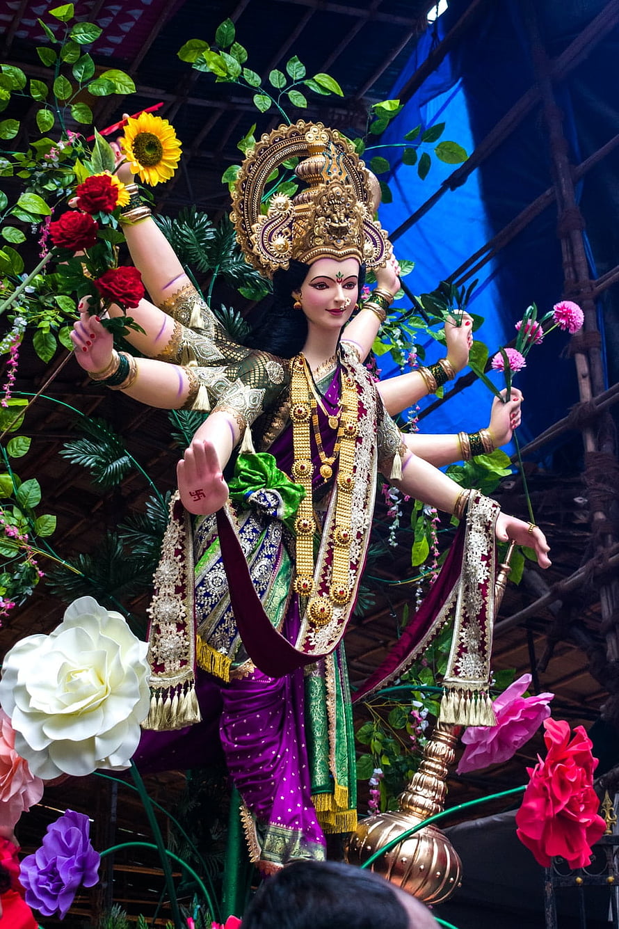 Ornate Durga Maa Idol Adorned in Purple Saree with Flowers and Gold Jewelry HD phone wallpaper