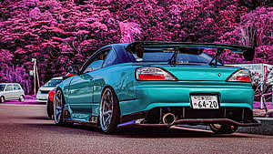 Cyan Nissan S15 Silvia with Large Rear Wing Parked Against Vibrant Pink Blossoms HD wallpaper