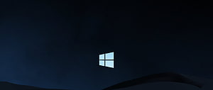 Minimalist Windows 10 Logo on Dark Blue Night Sky with Silhouetted Hills HD wallpaper