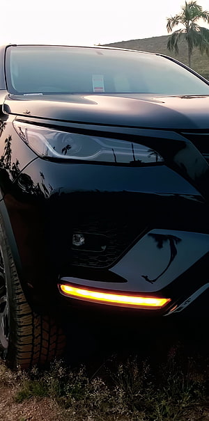 Black Toyota Fortuner Front Fascia With Glowing Amber DRL And Headlight Detail HD phone wallpaper