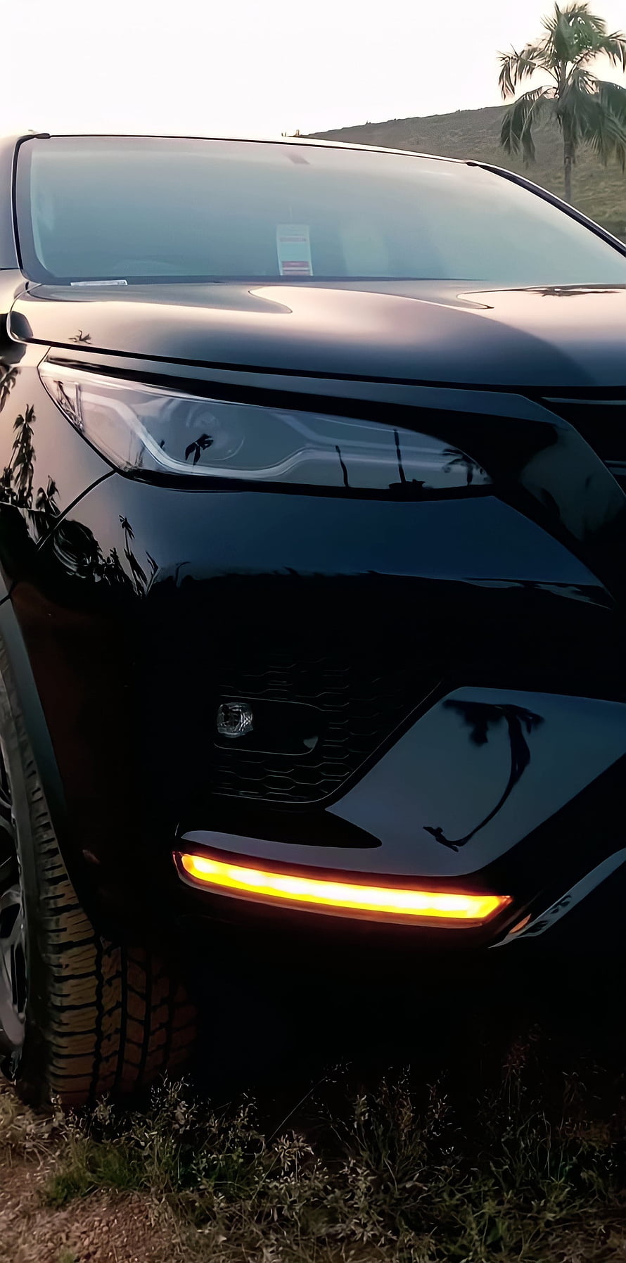 Black Toyota Fortuner Front Fascia With Glowing Amber DRL And Headlight Detail HD phone wallpaper