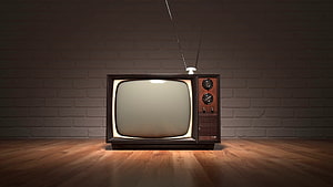 Vintage Retro Television Set With Antenna Against Brick Wall On Wooden Floor HD wallpaper