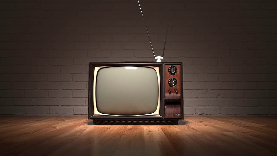 Vintage Retro Television Set With Antenna Against Brick Wall On Wooden Floor HD wallpaper