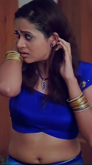 Bhavana Menon in a blue blouse with traditional gold bangles and a pendant necklace HD phone wallpaper