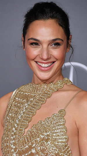 Gal Gadot in a Gold Beaded Gown at a Red Carpet Event HD phone wallpaper