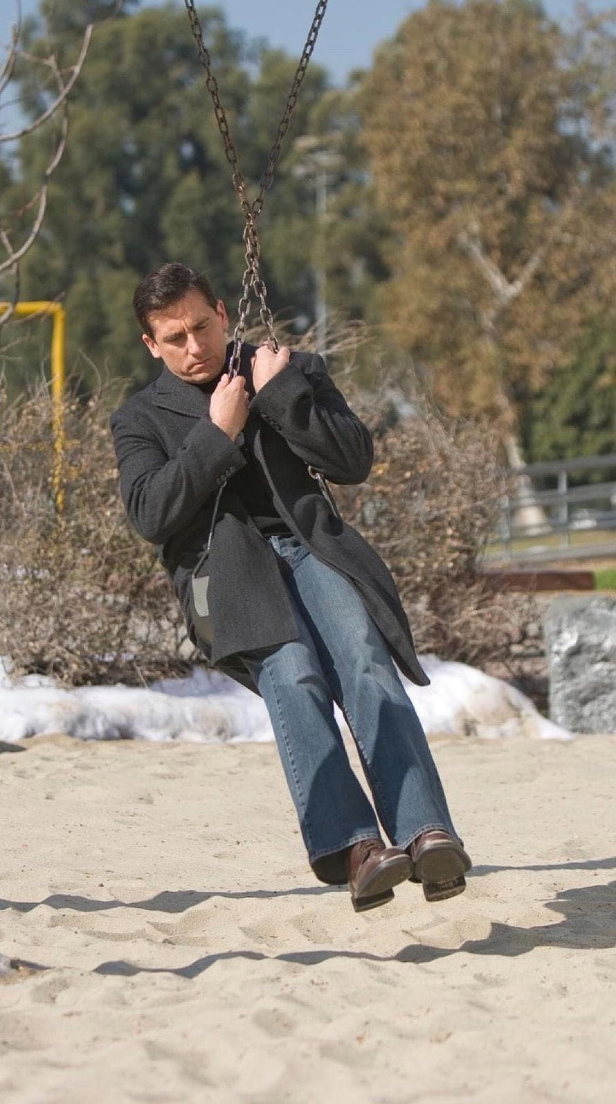 Steve Carell as Michael Scott on a chain swing in a park from The Office HD phone wallpaper