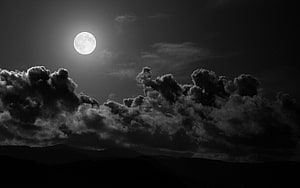 Monochrome Full Moon Rising Over Dramatic Cumulus Clouds and Mountain Silhouettes HD wallpaper