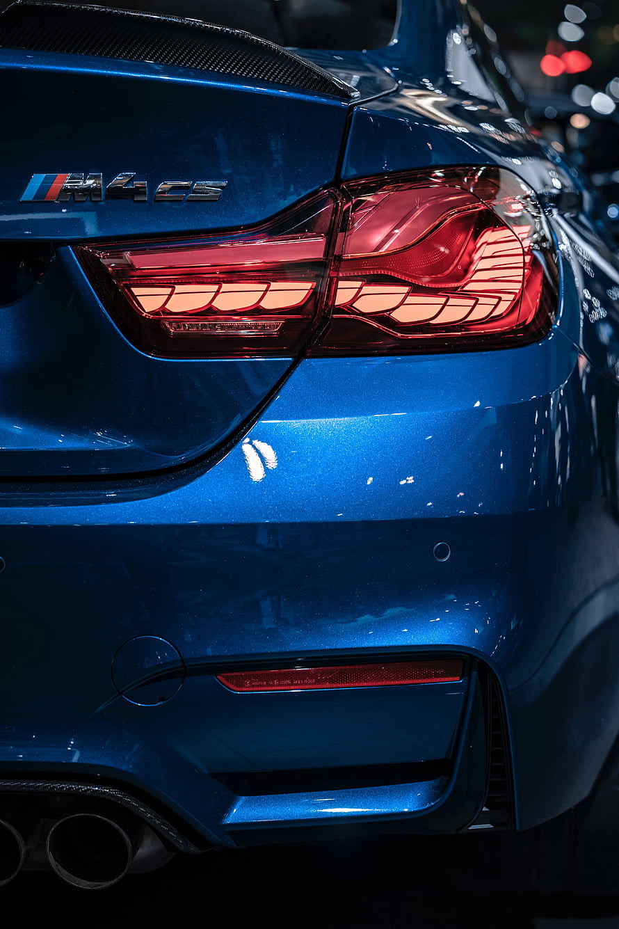 Rear Detail of a Blue BMW M4 CS with Carbon Fiber Spoiler and LED Taillights HD phone wallpaper