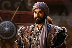 Ertugrul from Kurulus Osman in ornate medieval warrior attire with fur-trimmed armor and turban, Kurulus Osman, Ertugrul HD wallpaper