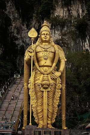 Giant Golden Murugan Statue at Batu Caves Temple in Malaysia HD phone wallpaper