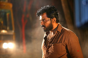 Karthi in Khaidi cinematic still with intense expression and dramatic lighting HD wallpaper