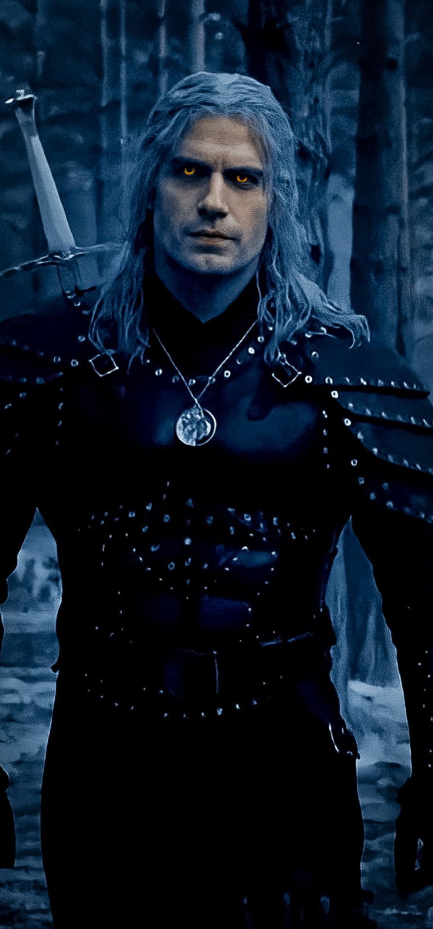 Geralt of Rivia in Dark Forest with Glowing Amber Eyes and Sword HD phone wallpaper