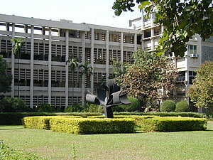 IIT Bombay Campus Garden with Modern Sculpture and Brutalist Architecture HD wallpaper