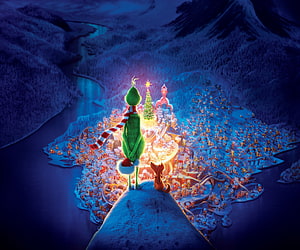 The Grinch and Max overlooking the glowing Christmas village in Whoville from the animated film HD wallpaper