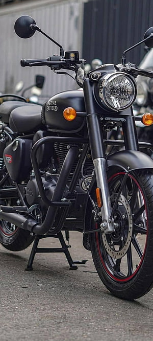 Stealth Black Royal Enfield Classic 350 Motorcycle with Red Rim Accents HD phone wallpaper