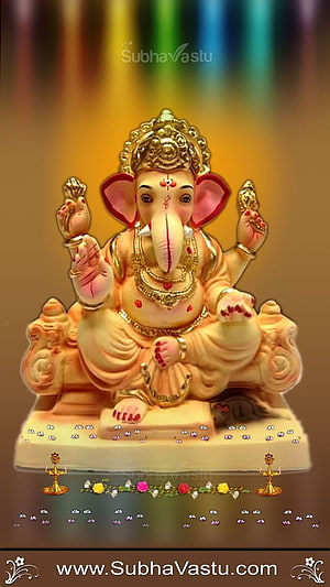 Golden Lord Ganesha Murti with Diya Lamps and Floral Garland on Warm Background HD phone wallpaper