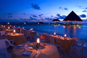 Romantic Candlelit Beach Dinner at Dusk with Overwater Pavilion and Ocean View HD wallpaper