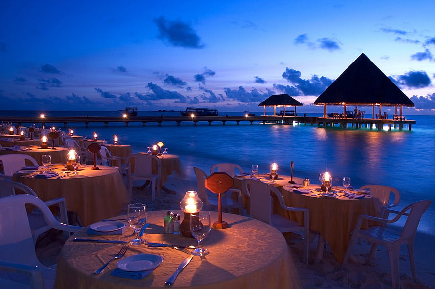 Romantic Candlelit Beach Dinner at Dusk with Overwater Pavilion and Ocean View HD wallpaper