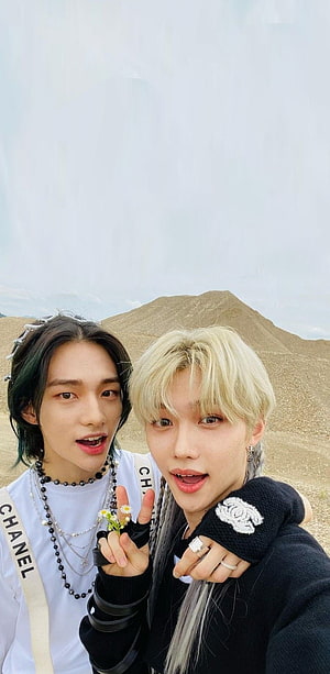 Stray Kids Felix and Hyunjin Selfie in Desert Landscape HD phone wallpaper