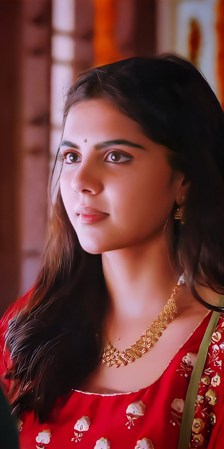 Kalyani Priyadarshini in a red embroidered blouse with gold necklace and traditional Indian jewelry HD phone wallpaper