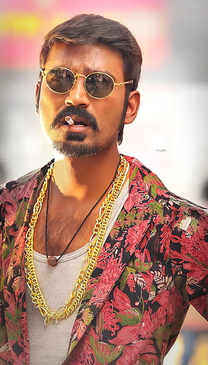 Dhanush in Maari wearing round sunglasses and gold chains with a floral shirt HD phone wallpaper