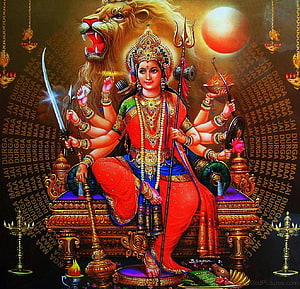 Maa Durga Devi Seated on Lion Throne with Multiple Arms and Divine Weapons HD wallpaper