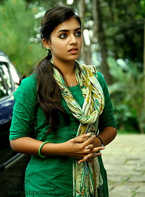 Nazriya Nazim in a green kurta with a patterned scarf standing outdoors HD phone wallpaper