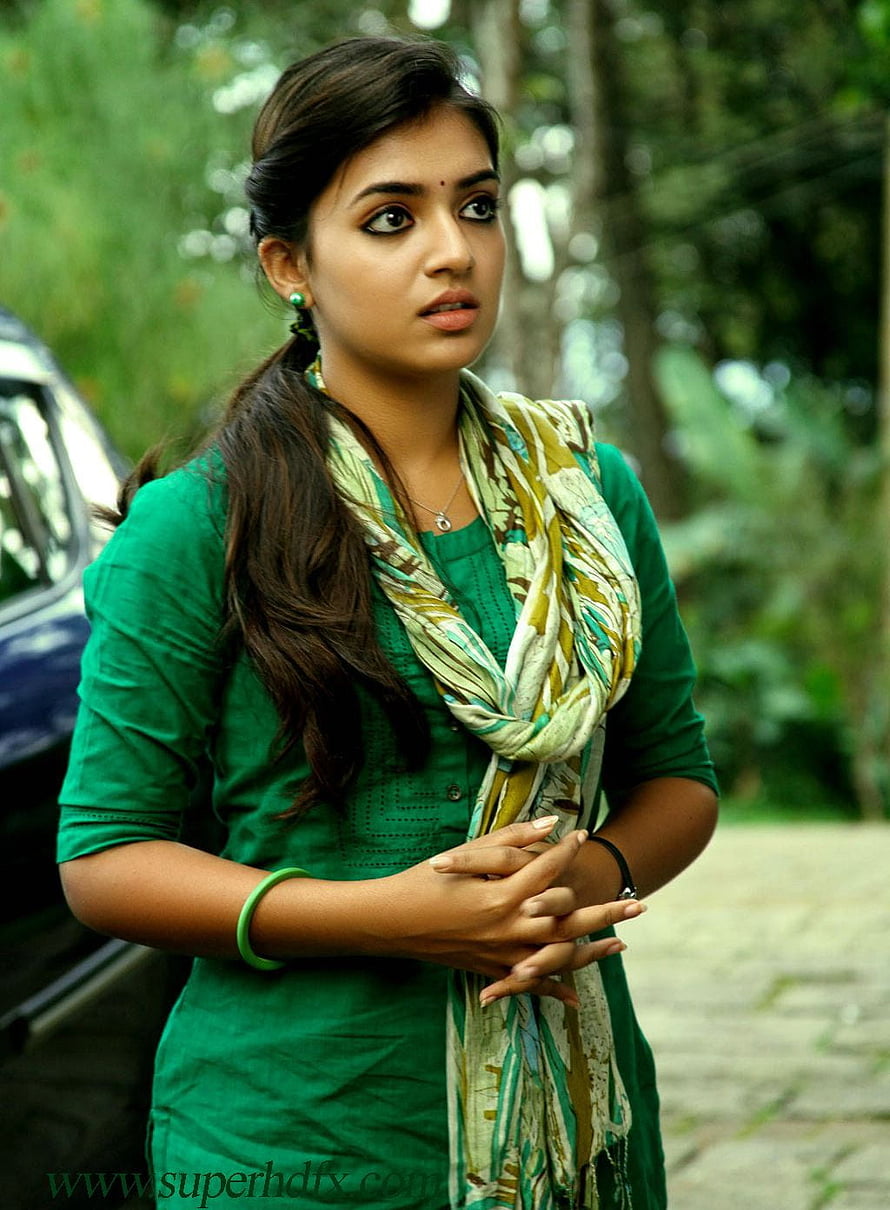 Nazriya Nazim in a green kurta with a patterned scarf standing outdoors HD phone wallpaper