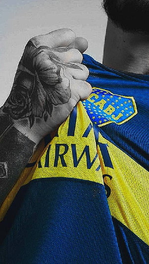 Boca Juniors Fan Holding Blue and Yellow Jersey with Rose Tattoo Close-Up HD phone wallpaper