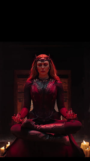Scarlet Witch Meditating in Dark Chamber with Candles and Red Lighting HD phone wallpaper