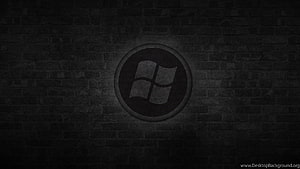 Dark Windows Logo on Textured Brick Wall with Subtle Spotlight Effect HD wallpaper