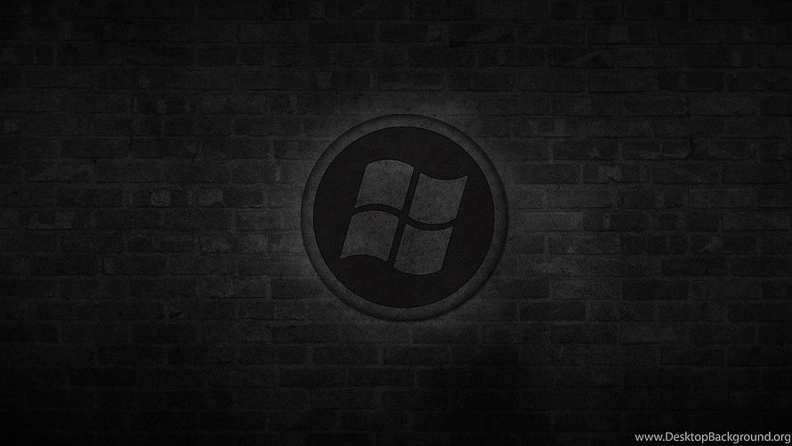 Dark Windows Logo on Textured Brick Wall with Subtle Spotlight Effect HD wallpaper