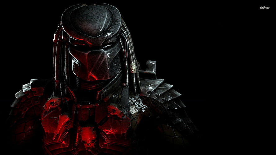 Predator Alien Warrior in Dark Armor with Red Glowing Visor and Skull Chest Plate HD wallpaper