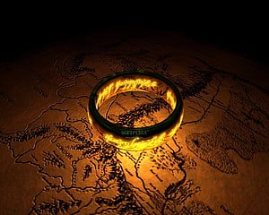 The One Ring from Lord of the Rings Glowing Over a Middle Earth Fantasy Map HD wallpaper
