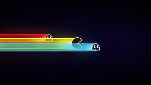 Pac-Man and Ghosts Racing Through Neon Rainbow Trails on Dark Background HD wallpaper
