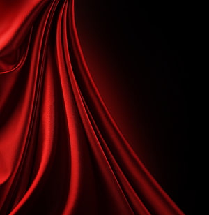 Glossy Red Silk Fabric Draped Against a Dark Background HD phone wallpaper