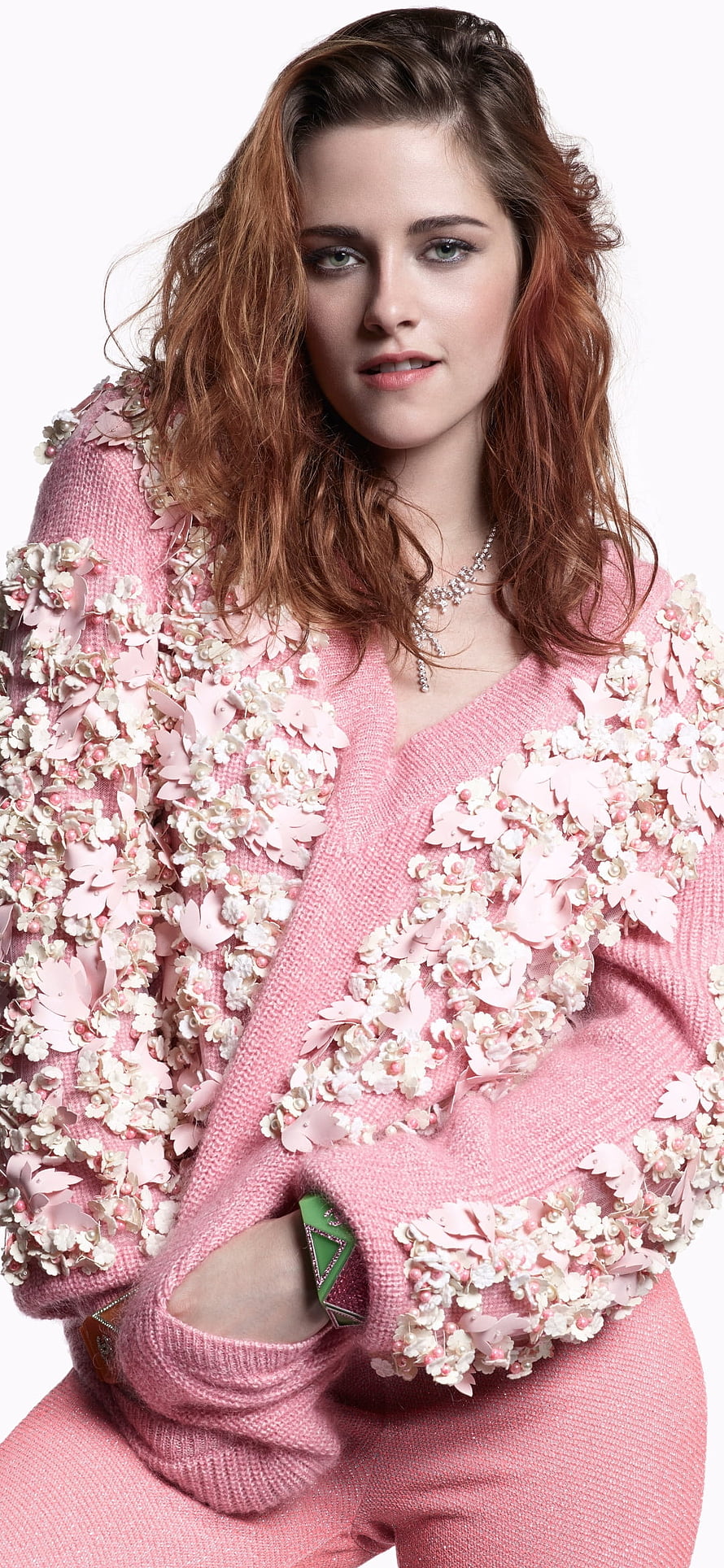 Kristen Stewart in a floral embellished pink knit cardigan with statement jewelry HD phone wallpaper