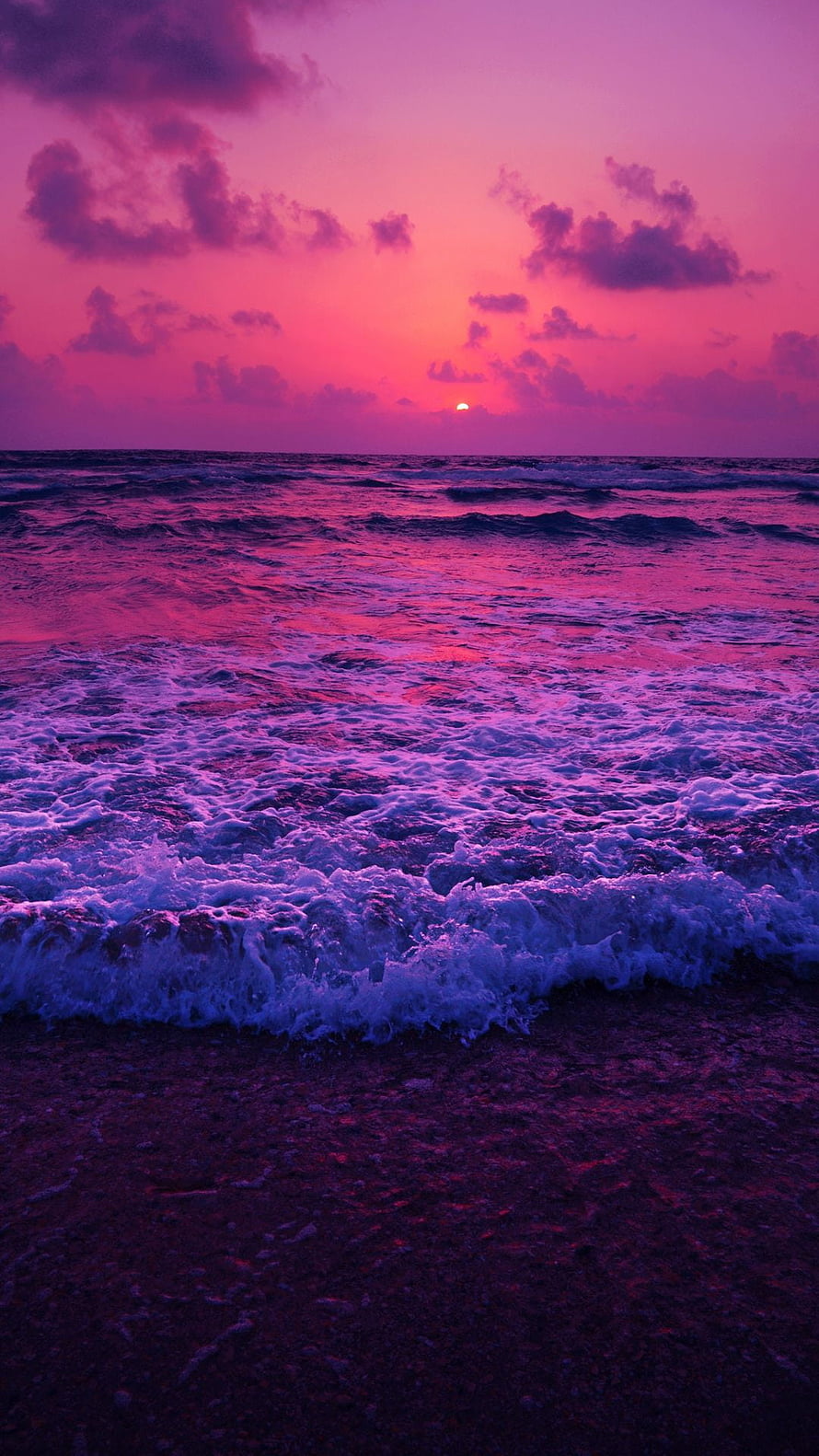 Vibrant Purple Ocean Sunset with Foaming Waves on a Dark Sandy Shore HD phone wallpaper