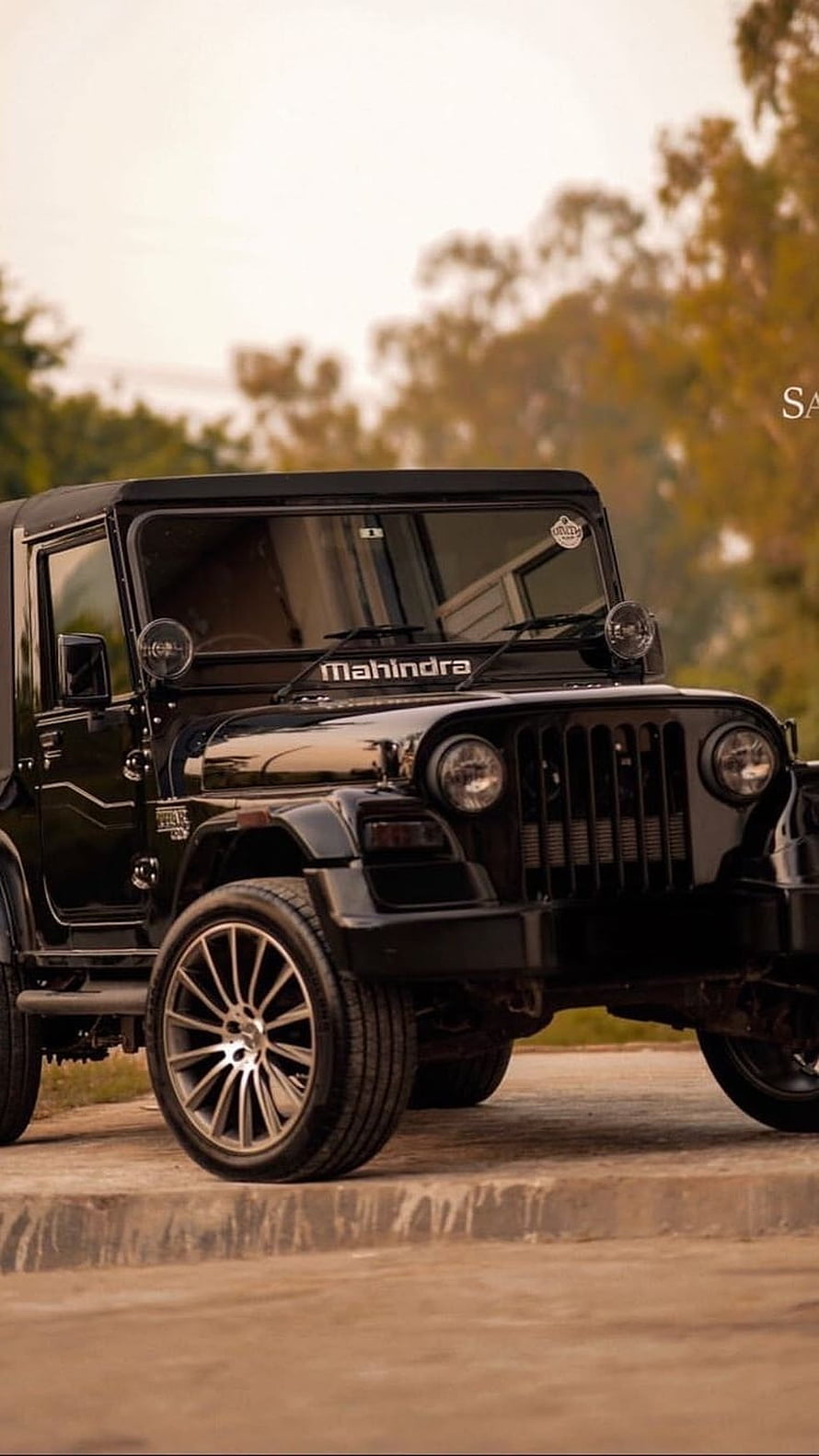 Black Mahindra Thar SUV with Custom Alloy Wheels Parked on a Concrete Surface HD phone wallpaper
