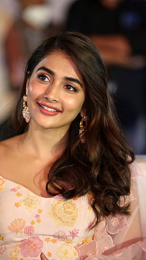 Pooja Hegde in a floral embroidered gown with elegant drop earrings at a red carpet event HD phone wallpaper