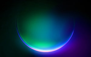 Windows 11 Default Wallpaper Featuring a Glowing Green and Purple Neon Orb on a Dark Background HD wallpaper